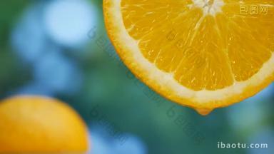 <strong>果汁</strong>滴流到花园里的橘子水果上